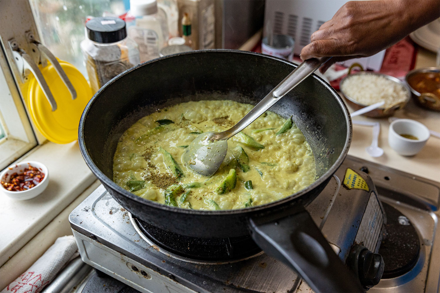 A taste of home: Ira cooks watakolu (ridged gourd) curry